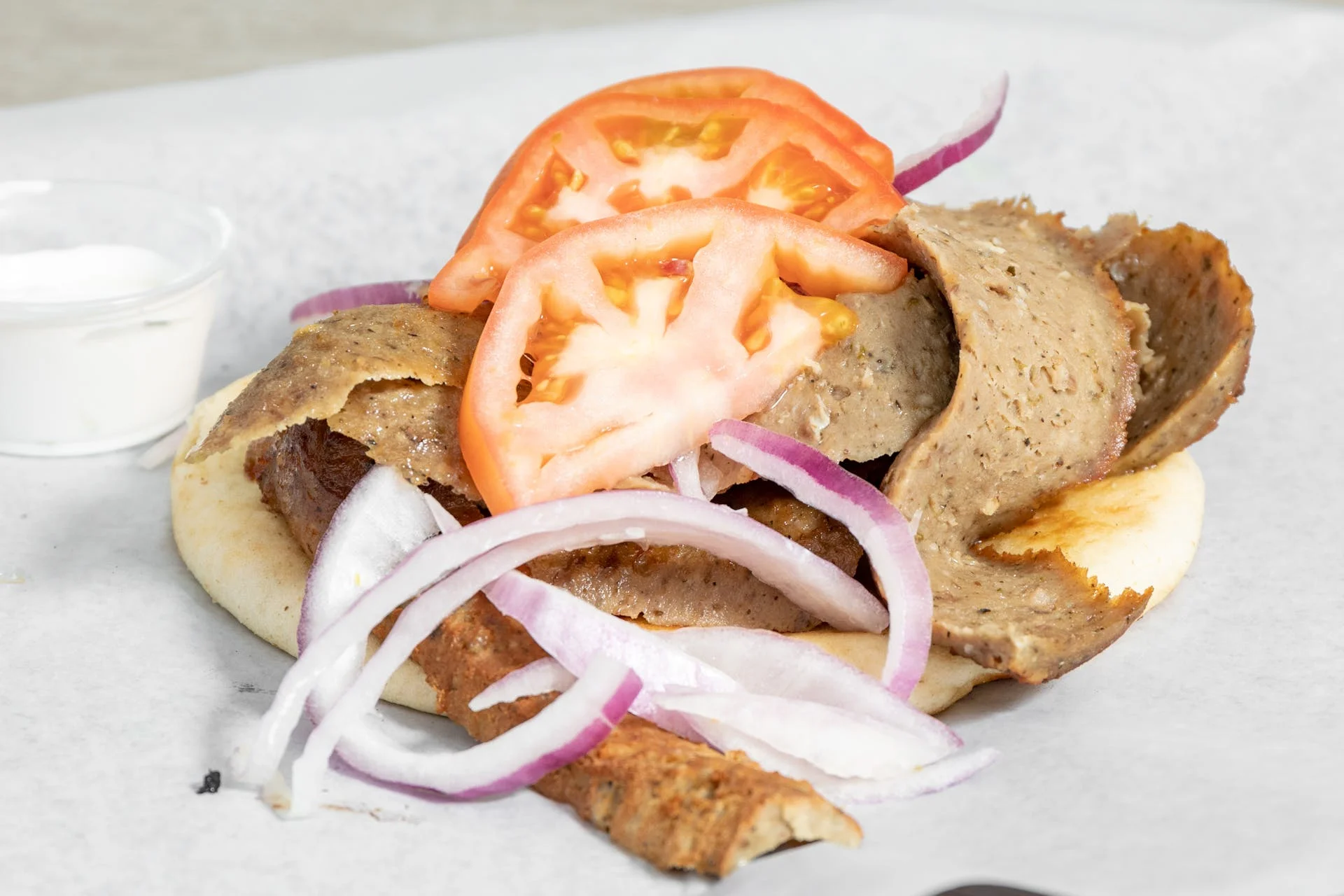 The whole neighborhood eats here. Pizza, gyros, burgers, fish — and the beef.